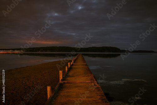 The Jasmunder Bodden coast after dark  with the pier in Lietzow  Mecklenburg-Western Pomerania  Germany