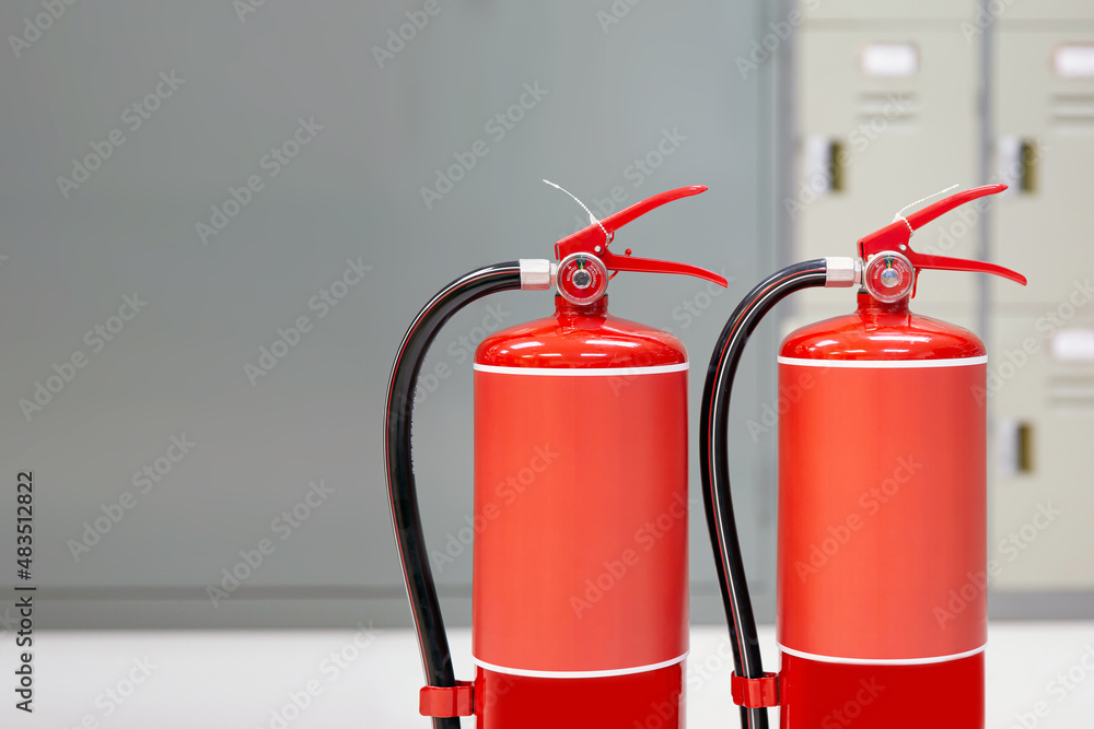 Fire extinguisher, Close-up red fire extinguishers tank in the building concepts of protection and prevent for emergency and safety rescue and fire training. Fire extinguisher, Close-up red fire extinguishers tank in the building concepts of protection and prevent for emergency and safety rescue and fire training.