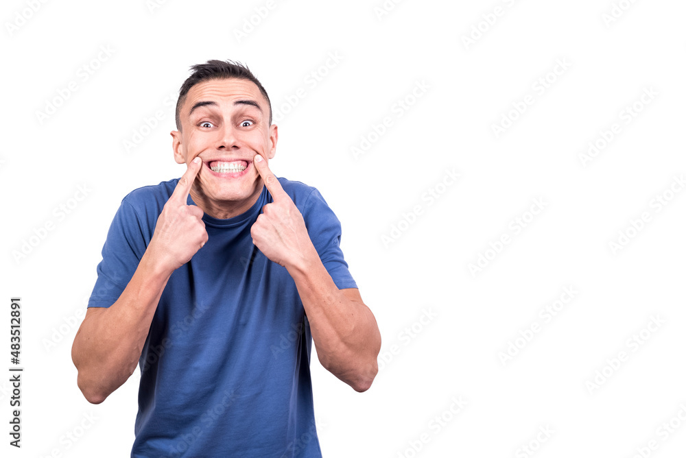 Man with two fingers to his lips showing a smile Man with two fingers to his lips showing a smile