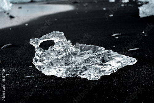 Shards of Diamond-Like Ice Line a Black Sand Diamond Beach in Iceland photo
