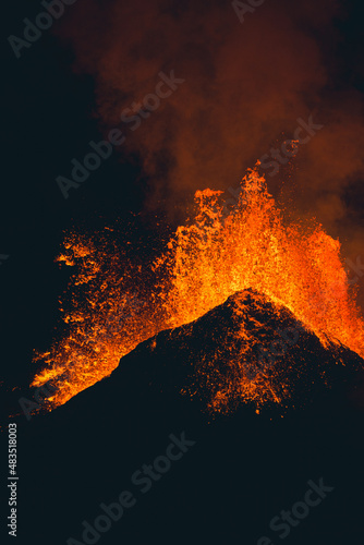 Orange Lava Splattering and Erupting out of Volcano at Night in Iceland