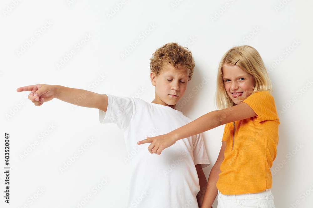 Boy and girl fun gestures with hands emotions childhood lifestyle unaltered Boy and girl fun gestures with hands emotions childhood lifestyle unaltered