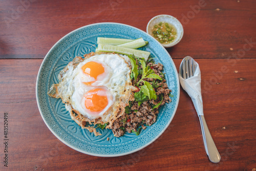 Thai basil stir-fried with eggs on rice