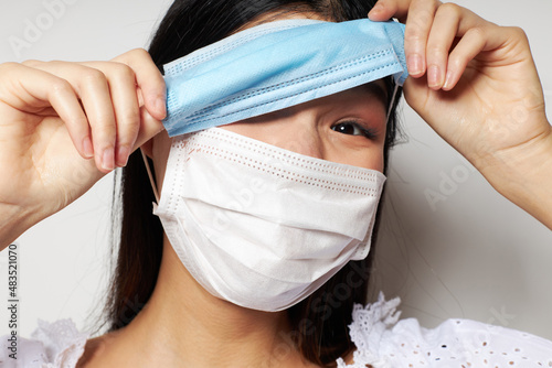 pretty brunette face shield safety close-up isolated background unaltered photo