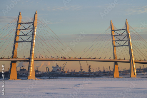 Cable-stayed bridge across the Ship Fairway on the Western High-Speed Diameter on the light of the setting sun on a December evening, Saint Petersburg