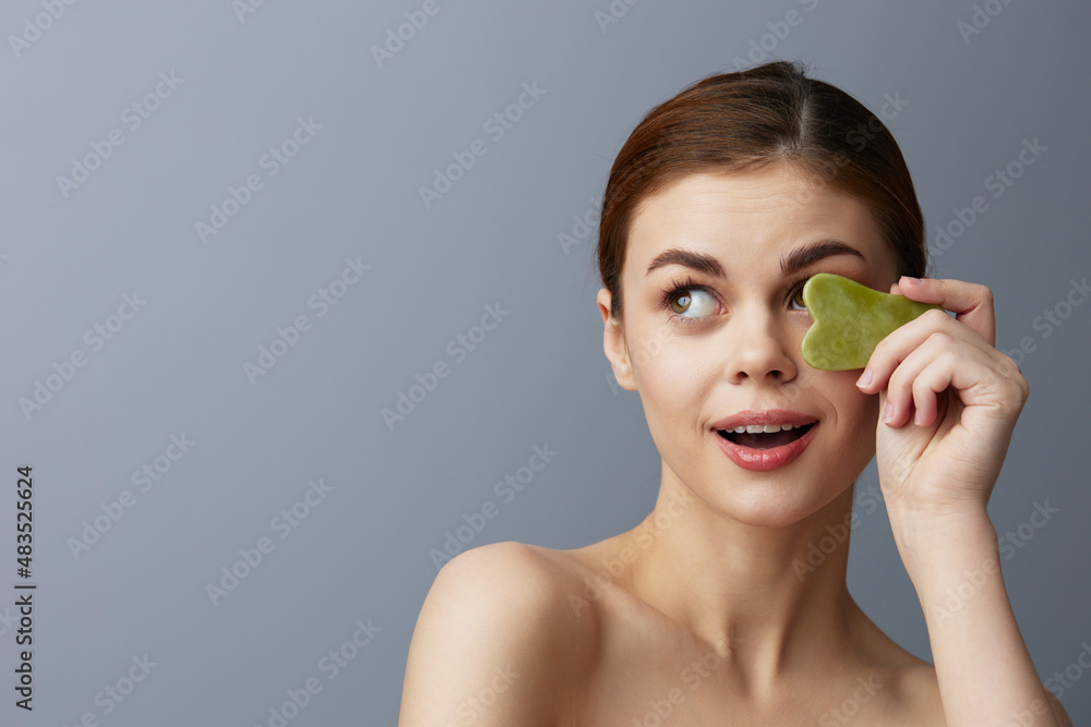 pretty woman facial scraper skin care posing isolated background pretty woman facial scraper skin care posing isolated background