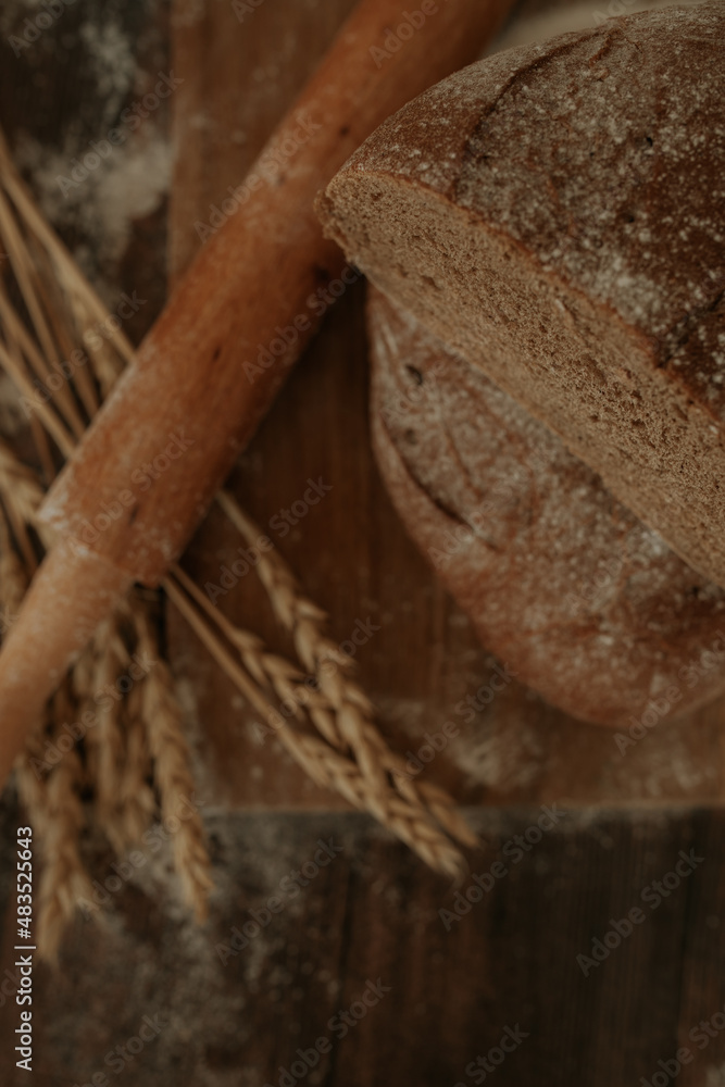 Fototapeta premium Half of rye bread. Wheat, bread, flour. vertical photo