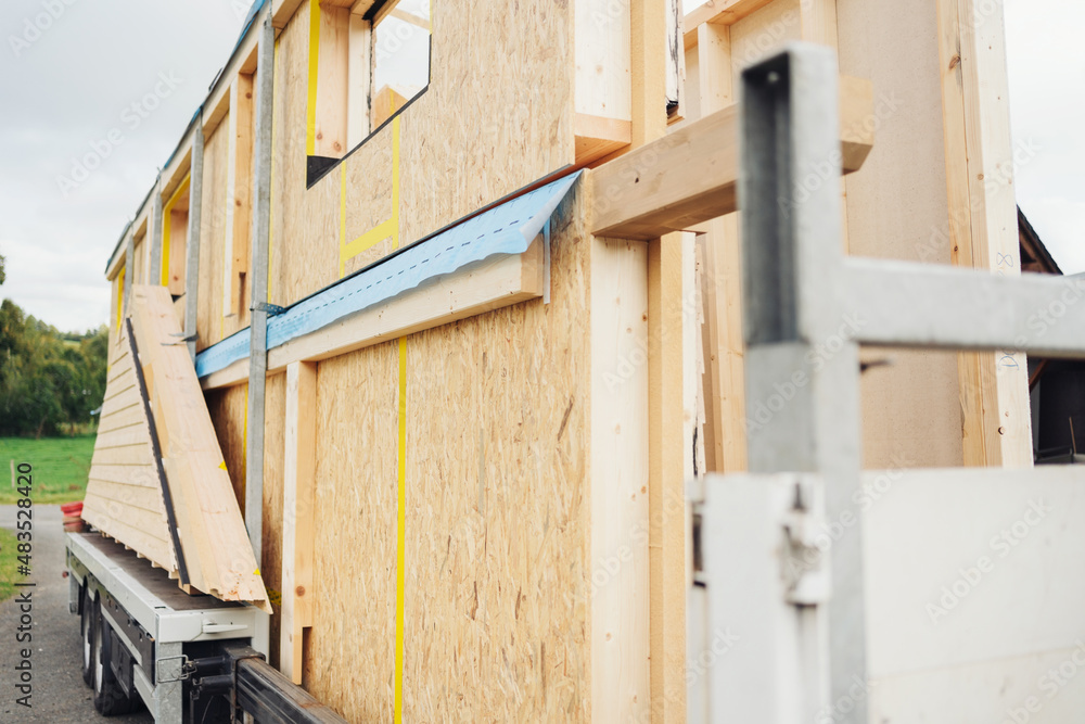 Lengths or sections of prefabricated wooden walls on a trailer Lengths or sections of prefabricated wooden walls on a trailer