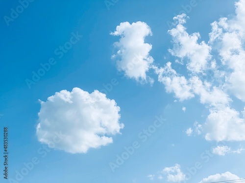 Bright blue sky with clouds. Concept about freedom and relax. © Sarah Saa