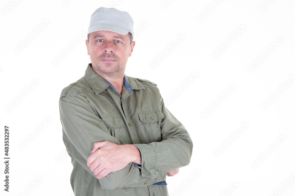handsome middle aged man arms crossed with military cap on white background handsome middle aged man arms crossed with military cap on white background