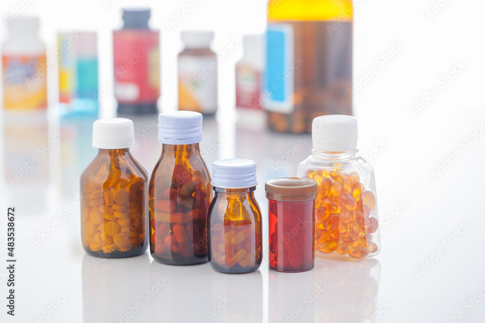 medicine bottle and pills on white background medicine bottle and pills on white background