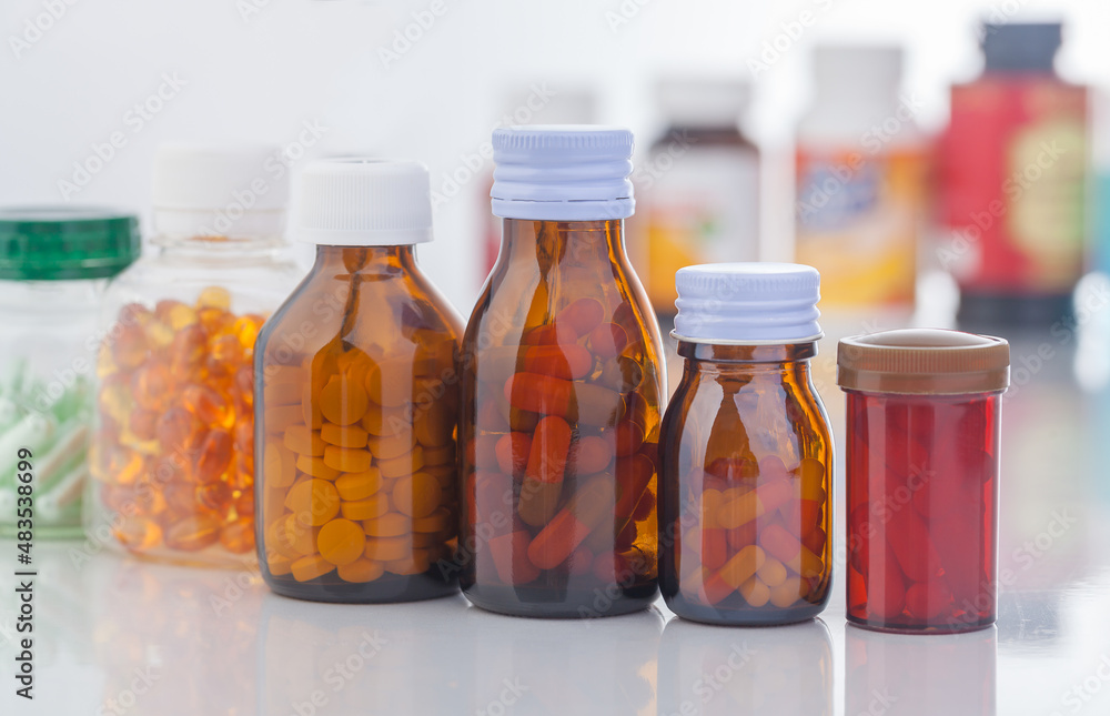 medicine bottle and pills on white background medicine bottle and pills on white background
