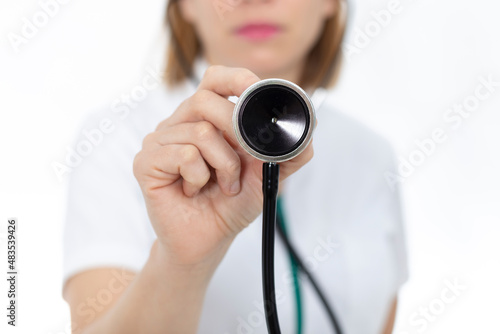 Doctor with stethoscope in her hands