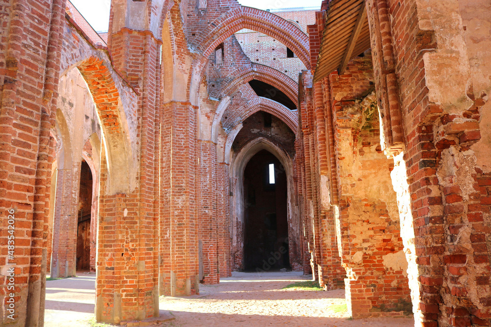 brick arches of an old abandoned and ruined cathedral - beautiful architectural landscape of a temple for a wallpaper 