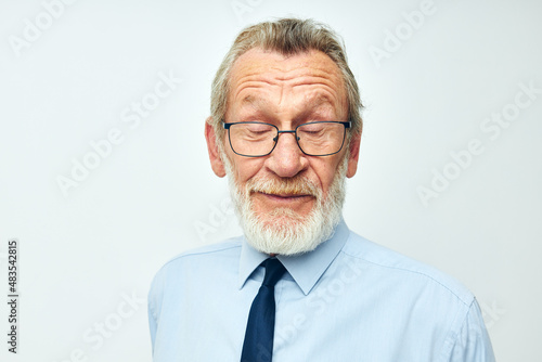 elderly man in shirt with tie gray hair office business