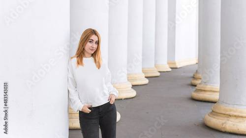 Young woman, student around college. Girl American appearance outdoor portrait 