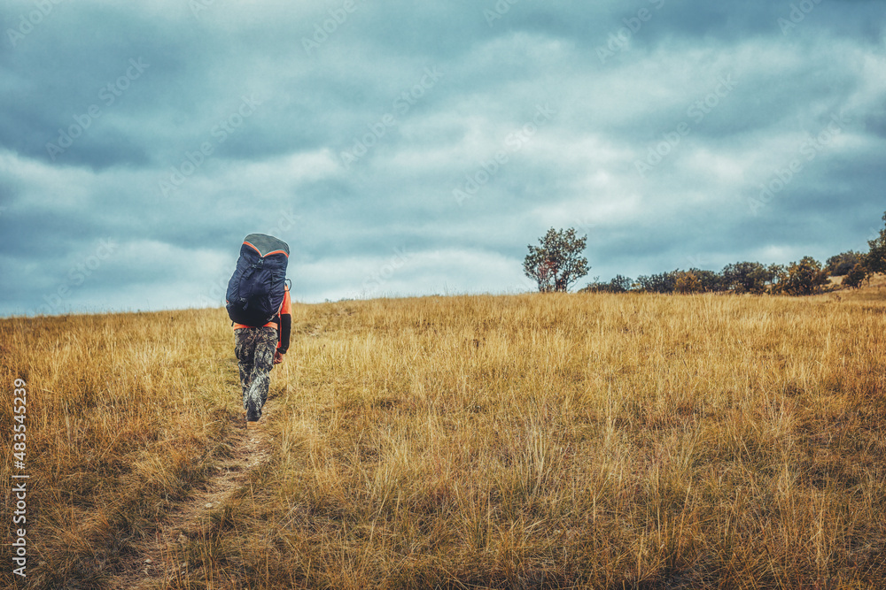Paragliding in the mountains, paraglider on the ground.