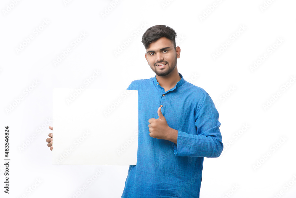 Indian man wearing traditional cloths and showing board on white background. Indian man wearing traditional cloths and showing board on white background.