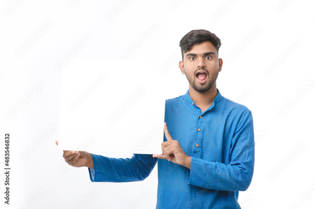 Indian man wearing traditional cloths and showing board on white background. Indian man wearing traditional cloths and showing board on white background.