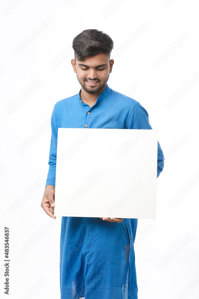 Indian man wearing traditional cloths and showing board on white background. Indian man wearing traditional cloths and showing board on white background.