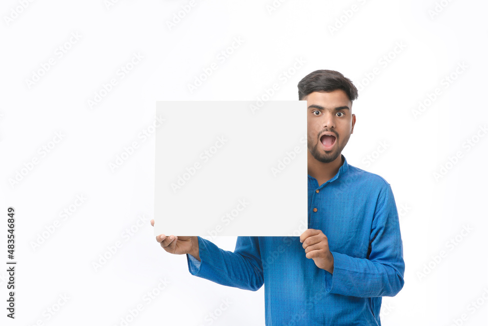 Indian man wearing traditional cloths and showing board on white background. Indian man wearing traditional cloths and showing board on white background.