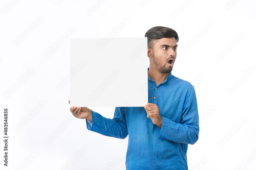 Indian man wearing traditional cloths and showing board on white background. Indian man wearing traditional cloths and showing board on white background.