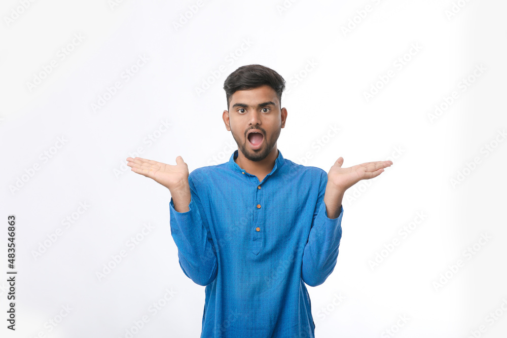 Indian man in tradition wear and giving expression on white background. Indian man in tradition wear and giving expression on white background.