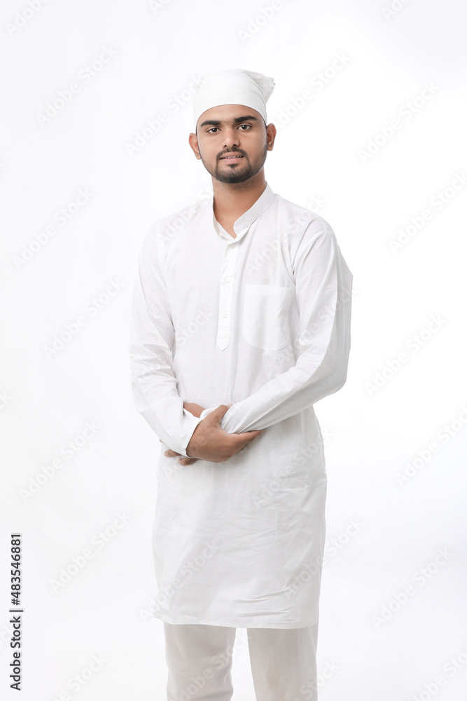 Indian muslim religious man praying on white background. Indian muslim religious man praying on white background.