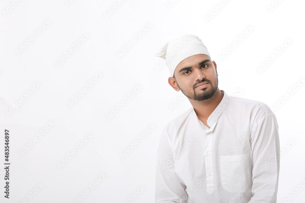 Indian muslim religious man praying on white background.