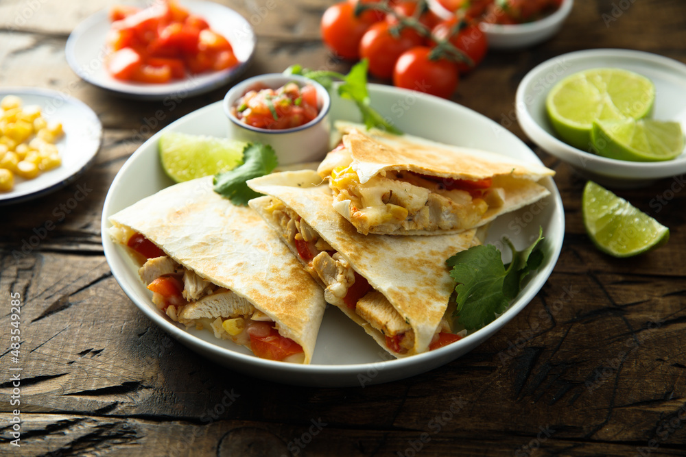 Homemade quesadilla with chicken and tomatoes Homemade quesadilla with chicken and tomatoes