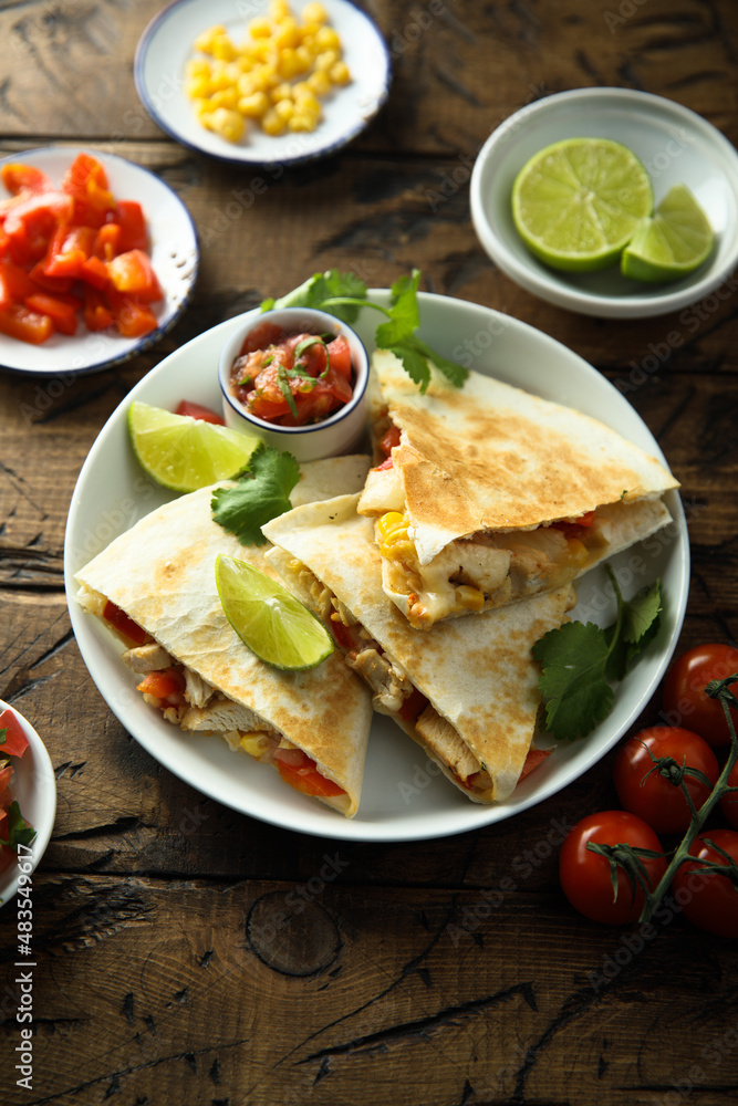 Homemade quesadilla with chicken and tomatoes Homemade quesadilla with chicken and tomatoes