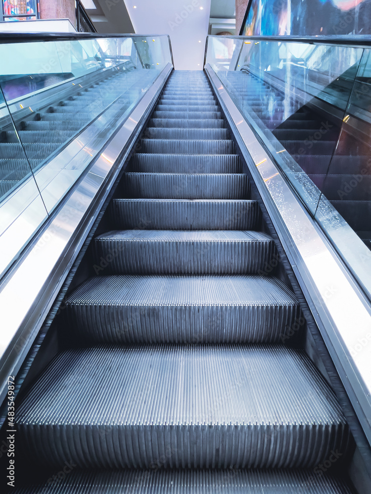 Modern escalator in the shopping center in a big city Modern escalator in the shopping center in a big city