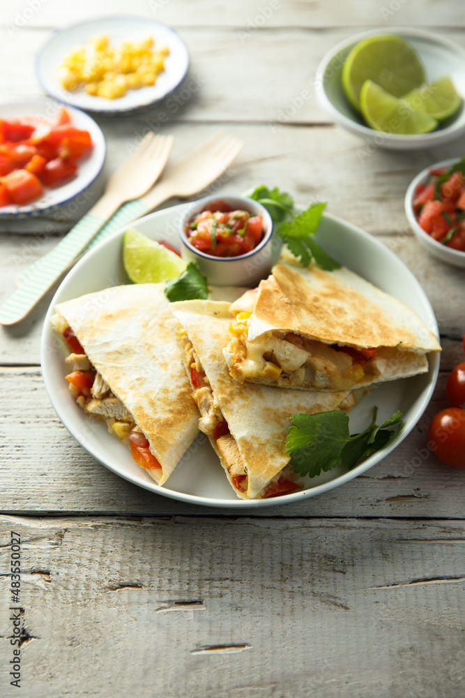 Homemade quesadilla with chicken and tomatoes Homemade quesadilla with chicken and tomatoes