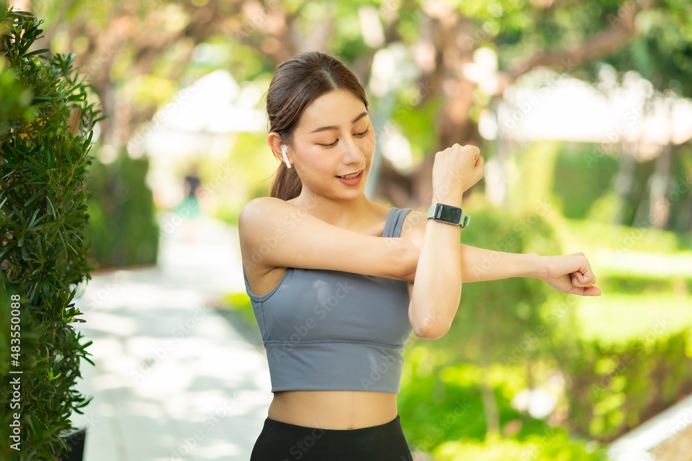 Running Asian woman. Female Runner Jogging during Outdoor Workout in a Park. Asian woman running in garden. Her morning exercise.Young Asian Girl doing yoga in the park Running Asian woman. Female Runner Jogging during Outdoor Workout in a Park. Asian woman running in garden. Her morning exercise.Young Asian Girl doing yoga in the park