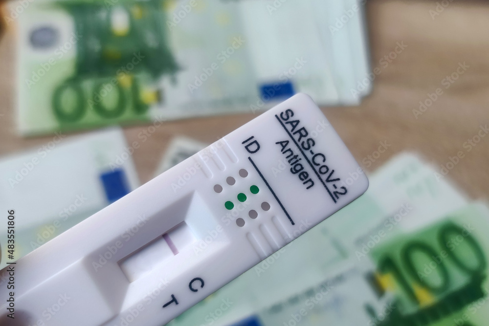 Coronavirus rapid antigen test with euro banknotes. Corona virus SARS-Cov-2 fast negative test. test cassette on several euro banknotes concept
