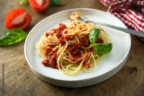 Spaghetti with homemade tomato sauce and basil