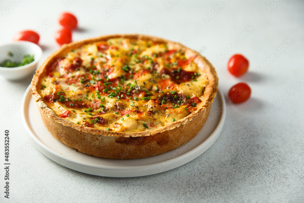 Homemade chicken quiche with tomatoes and pepper Homemade chicken quiche with tomatoes and pepper