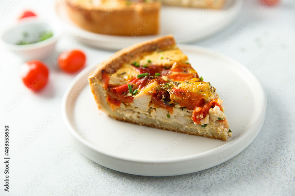 Homemade chicken quiche with tomatoes and pepper Homemade chicken quiche with tomatoes and pepper