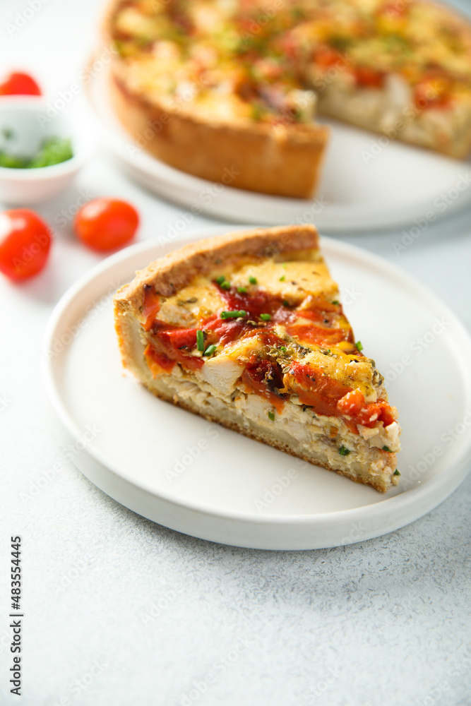 Homemade chicken quiche with tomatoes and pepper Homemade chicken quiche with tomatoes and pepper