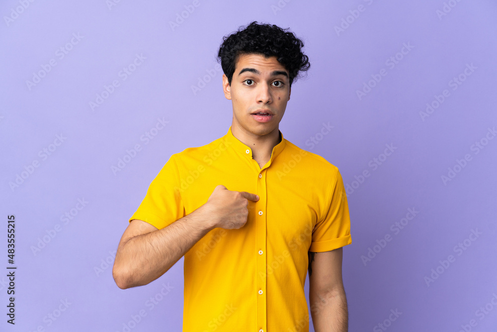 Young Venezuelan man isolated on purple background pointing to oneself Young Venezuelan man isolated on purple background pointing to oneself