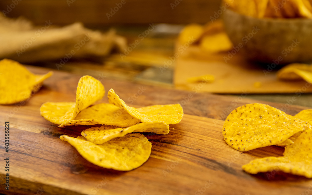 potato chips and beer on wooden background in a cafe, pub or at home potato chips and beer on wooden background in a cafe, pub or at home