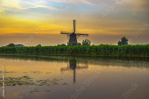Old dutch windmill at sunset in Kinderdijk, Netherlands