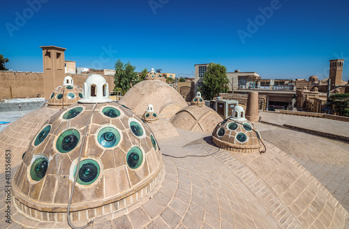 Domes on a roof of Sultan Amir Ahmad historic bathhouse in Kashan, Iran photo