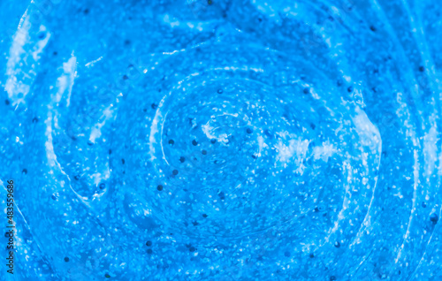 Body scrub close-up of blue color, particles of exfoliating ingredients, bubbles. Gel for cleansing the skin of the face and body. Spa treatments, skin care. kiwi seaweed goo lime green aqua