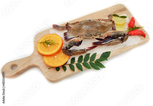 Selective focus of Fresh Three Spotted swimming Crab isolated on a White Background. photo