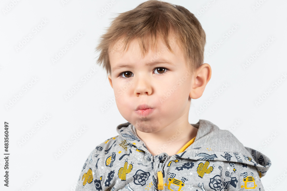 Cute little caucasian boy shows myofunctional trainer. Cute little caucasian boy shows myofunctional trainer.