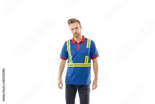 A middle-aged white man wearing a uniform standing over isolated white background. He looks happy and smiles. Worker and builder concept. © German