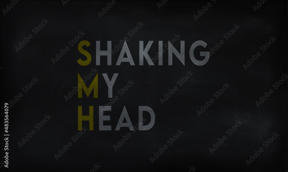 SHAKING MY HEAD (SMH) on chalk board SHAKING MY HEAD (SMH) on chalk board
