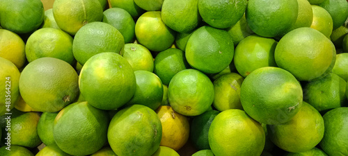 A pile of sweet lime which is also called as citrus limetta or mosambi photo