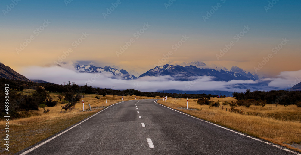 Panoramic view of Banner of traveling on the road with mountain range near Aoraki Mount Cook and the road leading to Mount Cook Village in New zealand	